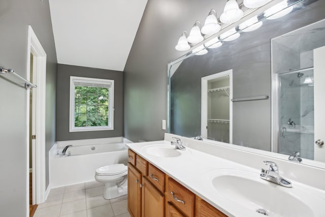 full bathroom with independent shower and bath, lofted ceiling, vanity, toilet, and tile patterned floors