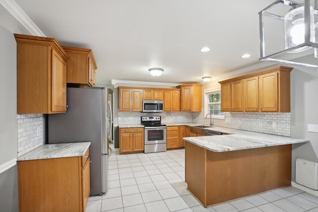 kitchen with sink, light tile patterned floors, ornamental molding, appliances with stainless steel finishes, and kitchen peninsula