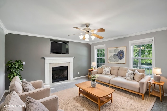 living room featuring crown molding, ceiling fan, and light carpet