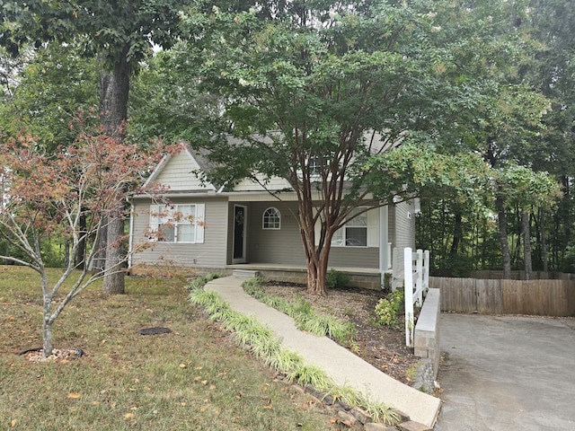 obstructed view of property with covered porch