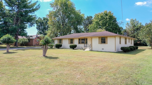 ranch-style house with a front lawn