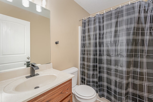 bathroom featuring vanity, a textured ceiling, toilet, and walk in shower