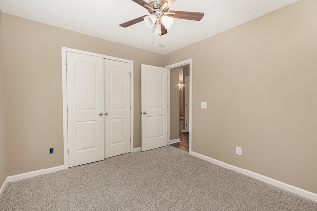 unfurnished bedroom featuring a closet, carpet, and ceiling fan