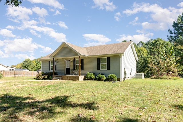 ranch-style home featuring a porch and a front lawn