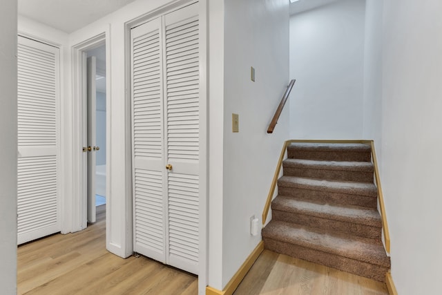 staircase featuring hardwood / wood-style flooring