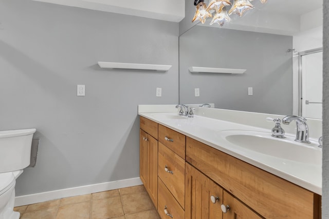 bathroom with walk in shower, vanity, toilet, and tile patterned flooring