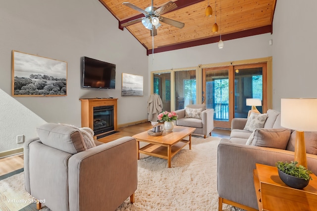 living room with wood ceiling, high vaulted ceiling, light hardwood / wood-style floors, and ceiling fan