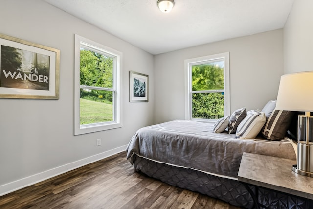 bedroom featuring dark wood-type flooring