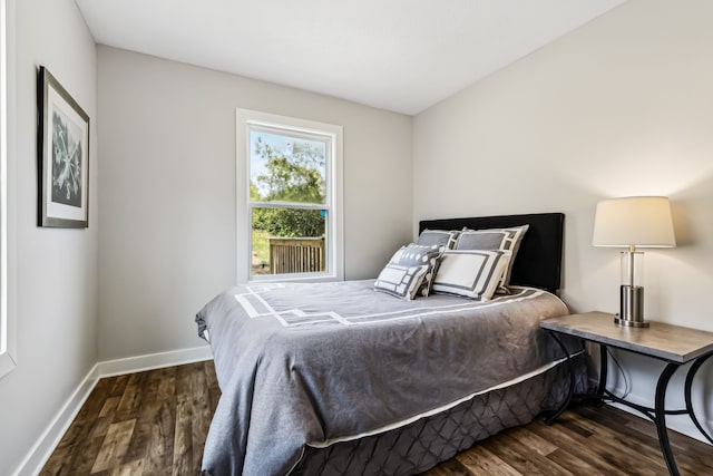 bedroom featuring dark wood-type flooring