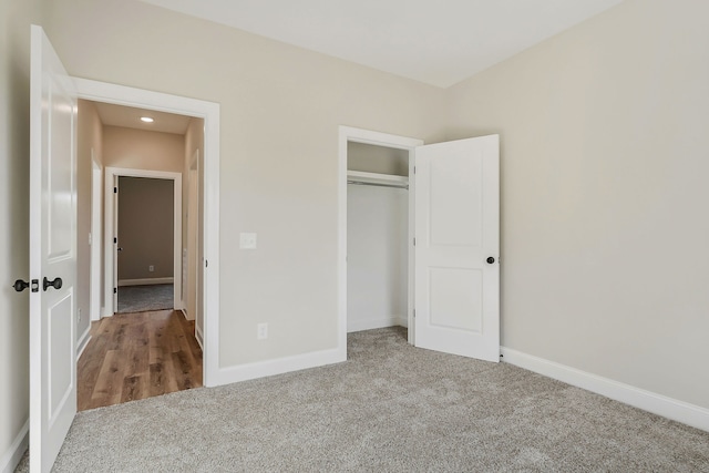 unfurnished bedroom featuring a closet and carpet floors