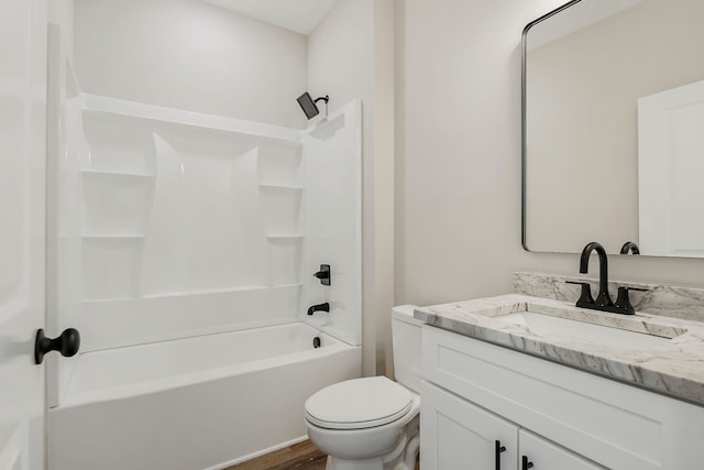 full bathroom featuring shower / tub combination, vanity, hardwood / wood-style flooring, and toilet