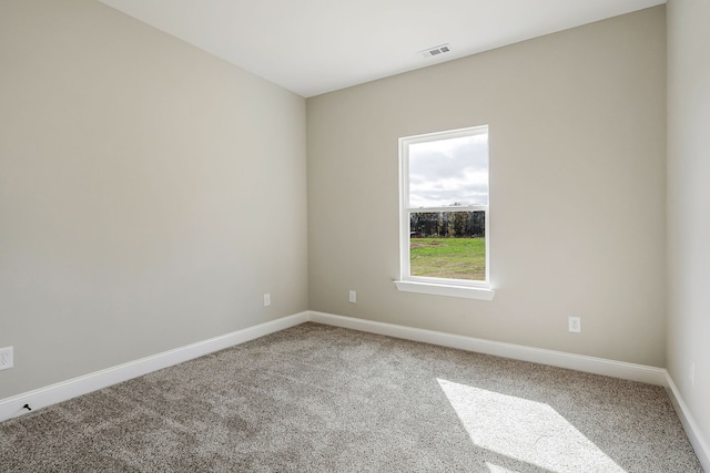 unfurnished room featuring carpet