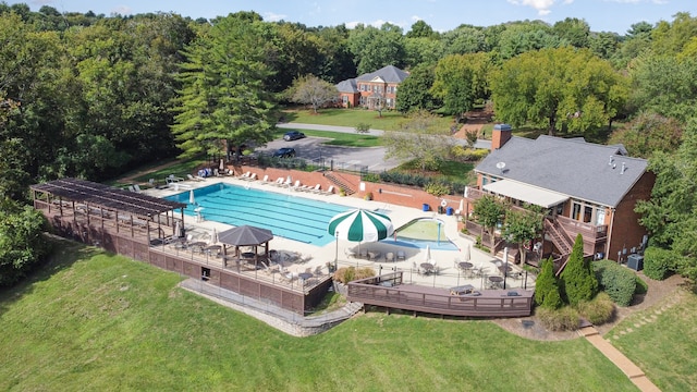 view of pool featuring a yard