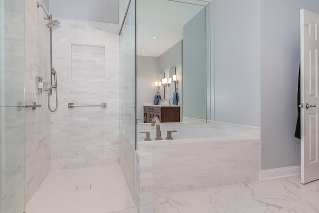 bathroom featuring vanity and separate shower and tub