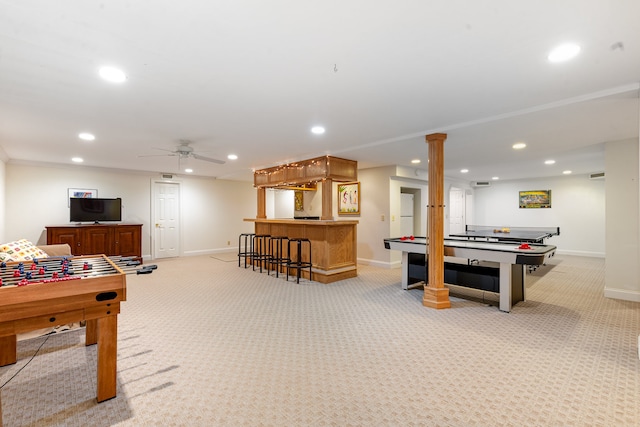 playroom featuring bar area, ceiling fan, and light colored carpet