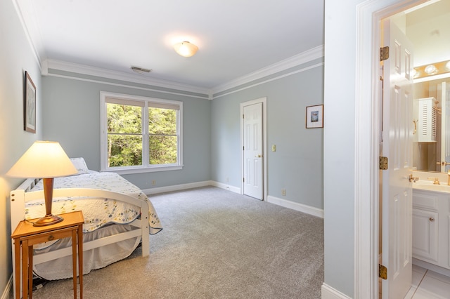 bedroom featuring light colored carpet, ensuite bath, and ornamental molding