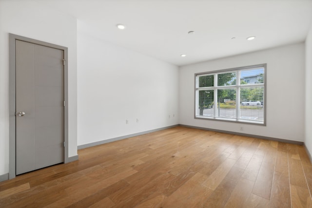 spare room with light wood-type flooring