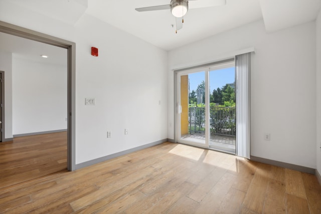 unfurnished room featuring light wood-type flooring and ceiling fan