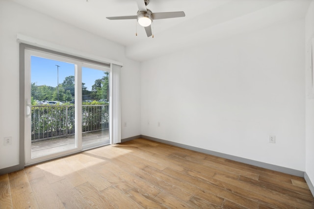 spare room with light hardwood / wood-style flooring and ceiling fan