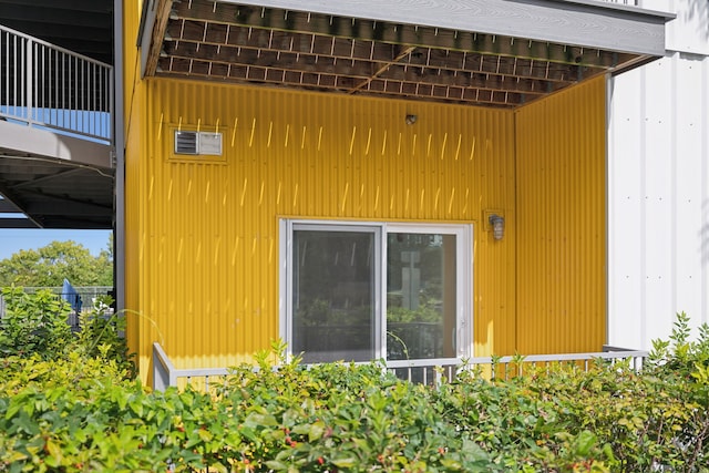 view of side of home with a balcony