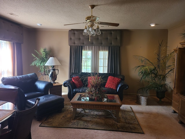 carpeted living room with ceiling fan and a textured ceiling