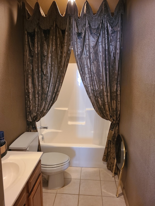 full bathroom featuring vanity, shower / bath combo with shower curtain, toilet, and tile patterned floors