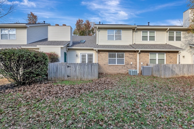 back of house featuring central AC unit