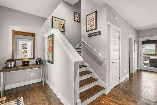 staircase with hardwood / wood-style floors