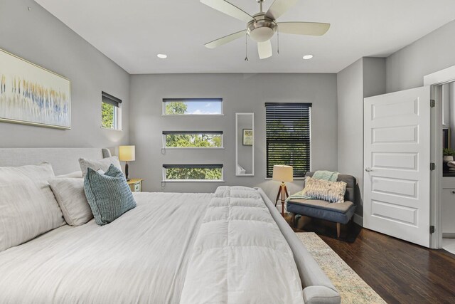 bedroom with ceiling fan and dark hardwood / wood-style floors