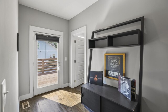 doorway to outside featuring dark hardwood / wood-style flooring