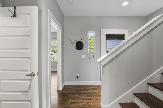 foyer with dark hardwood / wood-style floors