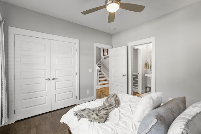 bedroom with ceiling fan, a closet, connected bathroom, and dark hardwood / wood-style flooring