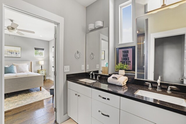 bathroom featuring ceiling fan, vanity, and hardwood / wood-style flooring