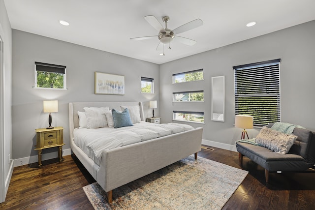 bedroom with ceiling fan and dark wood-type flooring