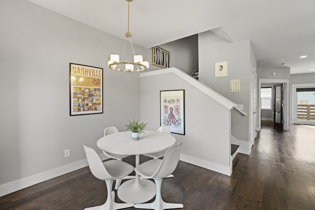 dining room with a chandelier and dark hardwood / wood-style floors