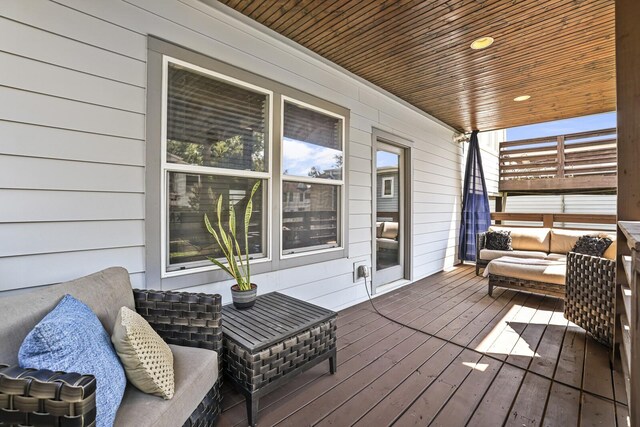 wooden deck featuring outdoor lounge area