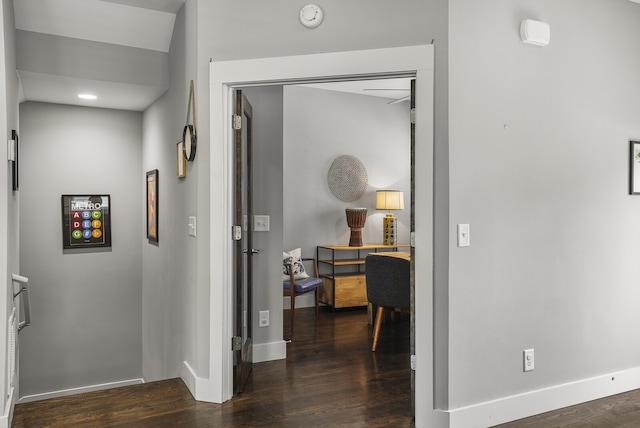 hallway with dark wood-type flooring