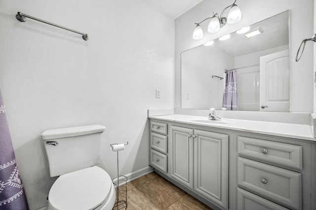 bathroom with vanity, toilet, tile patterned floors, and curtained shower