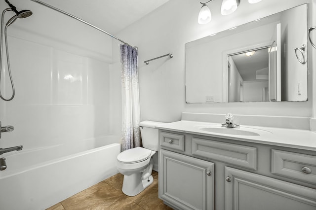 full bathroom featuring toilet, vanity, tile patterned floors, and shower / tub combo