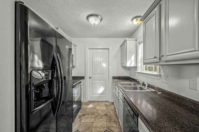 kitchen featuring gray cabinets, a textured ceiling, black appliances, and sink