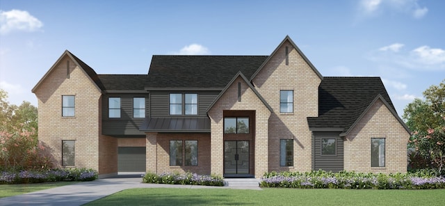 view of front of house with a garage and a front lawn