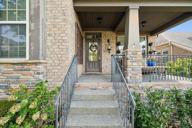 entrance to property featuring a porch