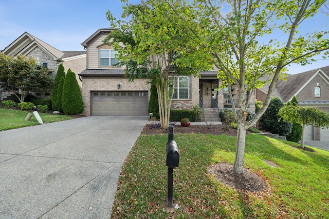 view of front of property featuring a front yard and a garage