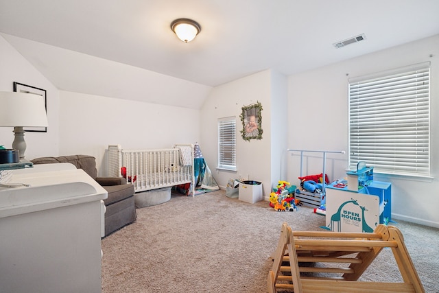 carpeted bedroom featuring vaulted ceiling