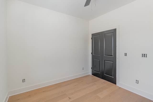 unfurnished room featuring light wood-type flooring and ceiling fan