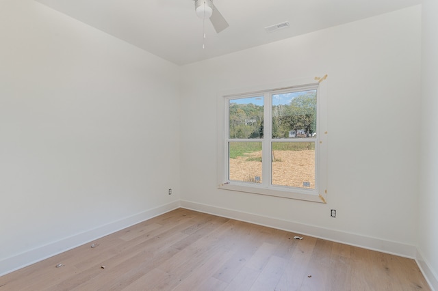 unfurnished room with ceiling fan and light wood-type flooring