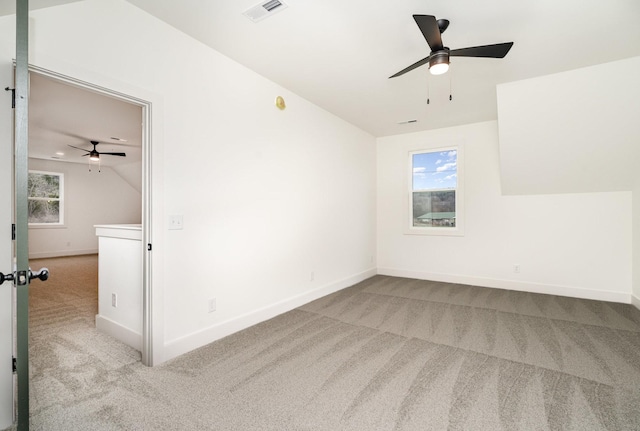 interior space featuring ceiling fan and vaulted ceiling