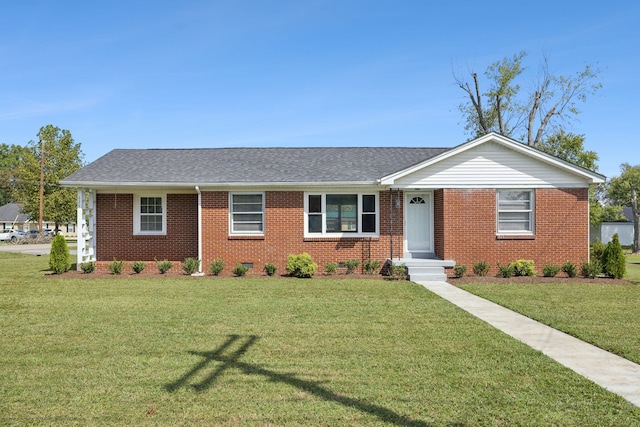 ranch-style house featuring a front lawn