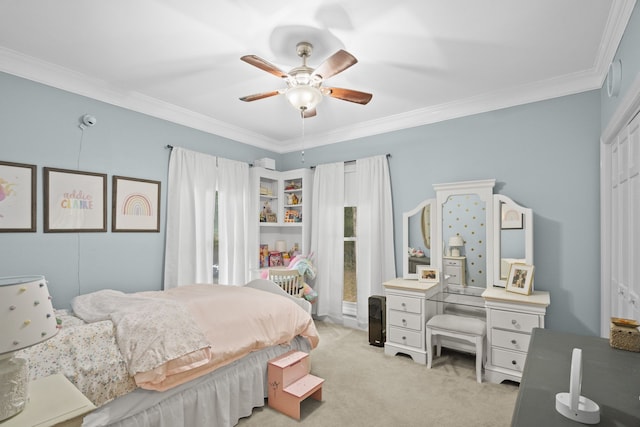 bedroom featuring light carpet, crown molding, and ceiling fan