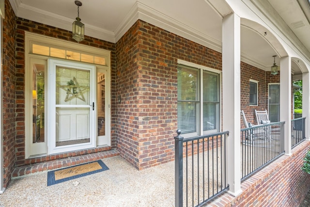 doorway to property featuring covered porch